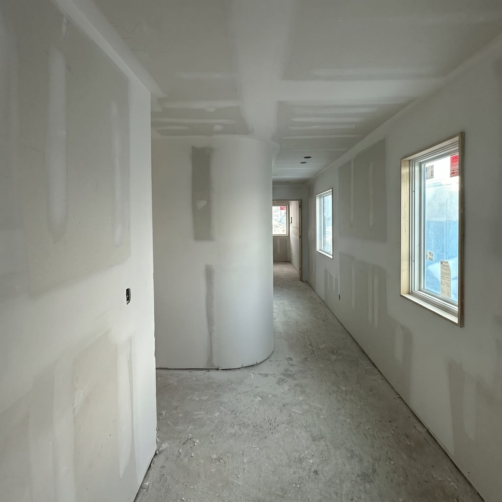 Custom curved drywall wall in residential hallway, fresh taping by J&R Drywall Toronto