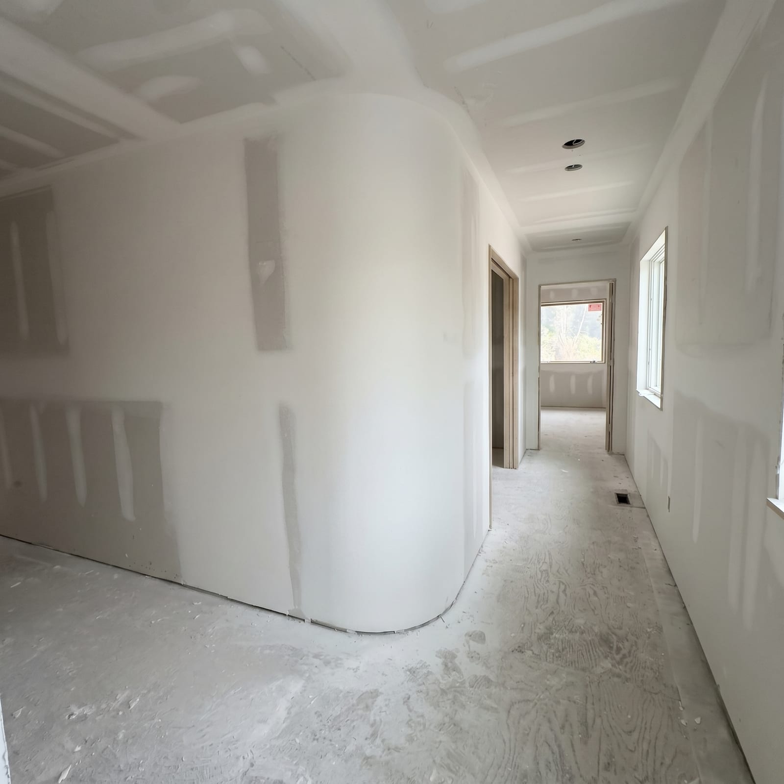 Curved drywall feature wall in new construction residential project Toronto general contractor